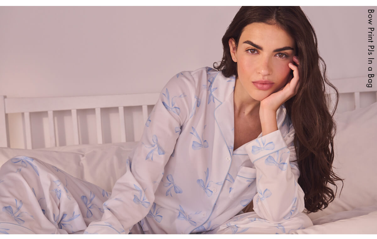 Bow print pyjamas in a bag