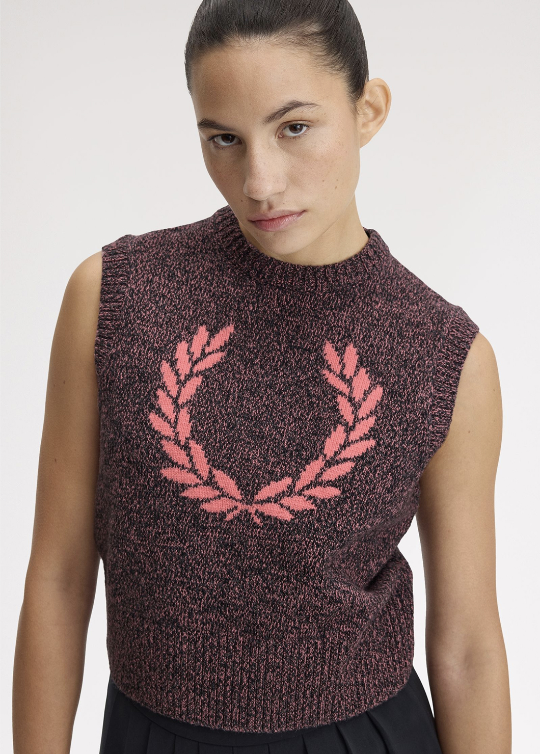 Female model wearing a Fred Perry Twisted Marl Knitted Tank in Flamingo Tan