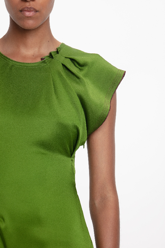 Pleat detail on green dress