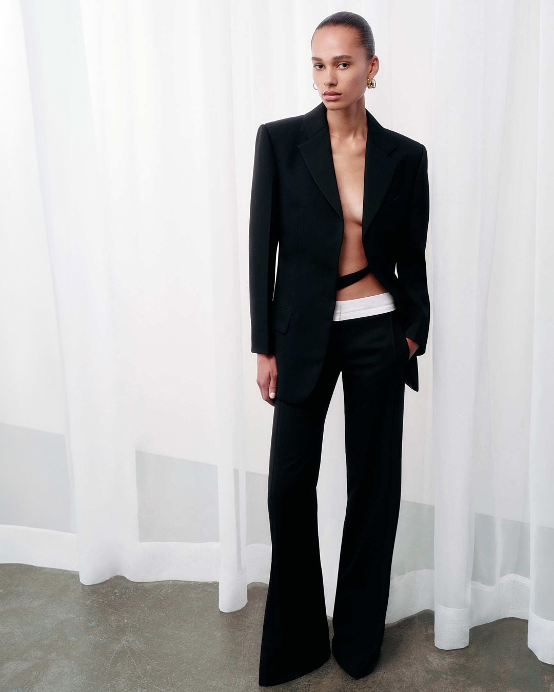 Women in black blazer and black trousers 