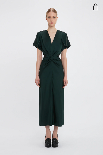 Women in dark green v-neck gathered waist midi dress