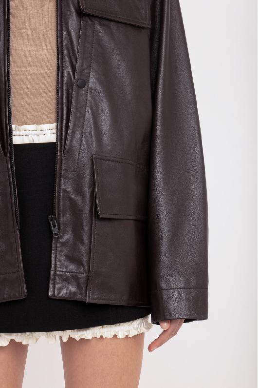 Women in brown leather jacket 