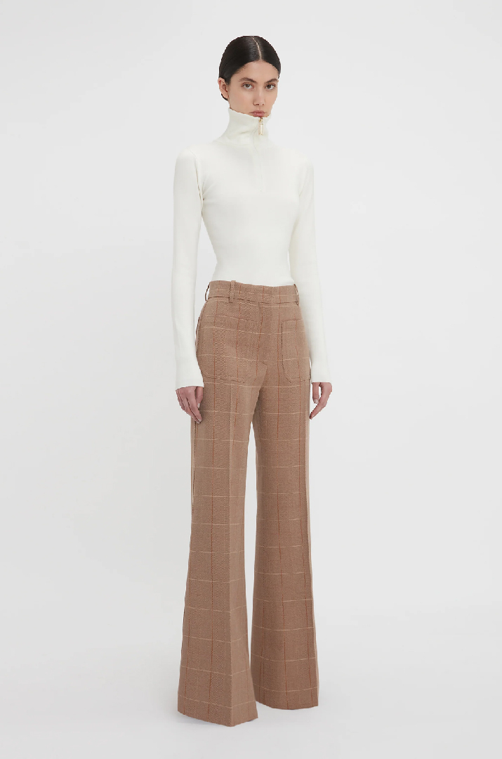 Women in brown check trousers 