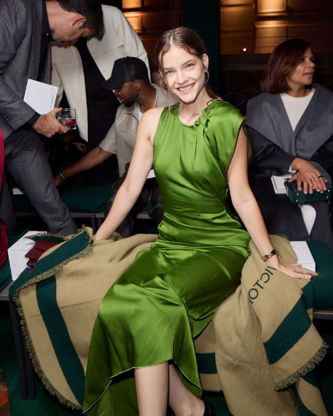 Women in green pleat detail midi dress