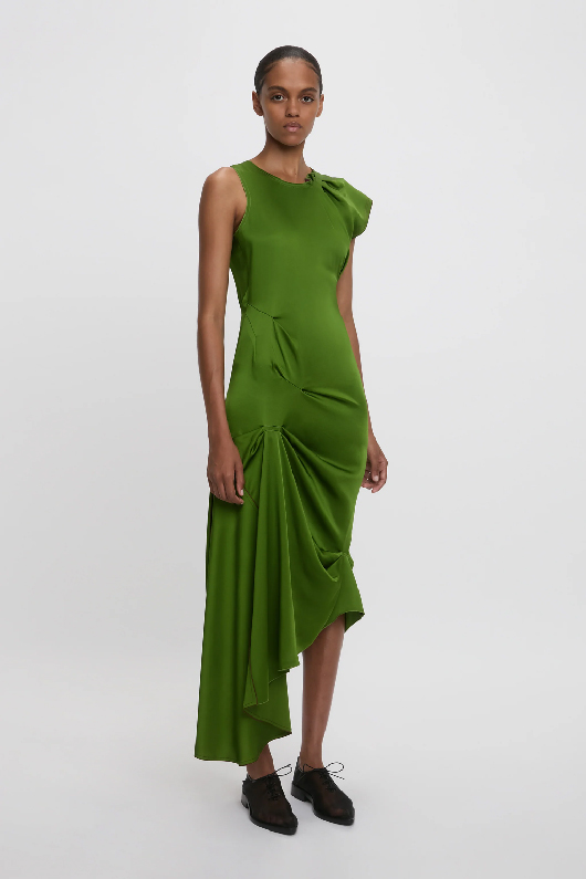Women in green pleat detail midi dress