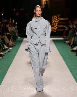 Women in jeans and denim jacket on the runway 