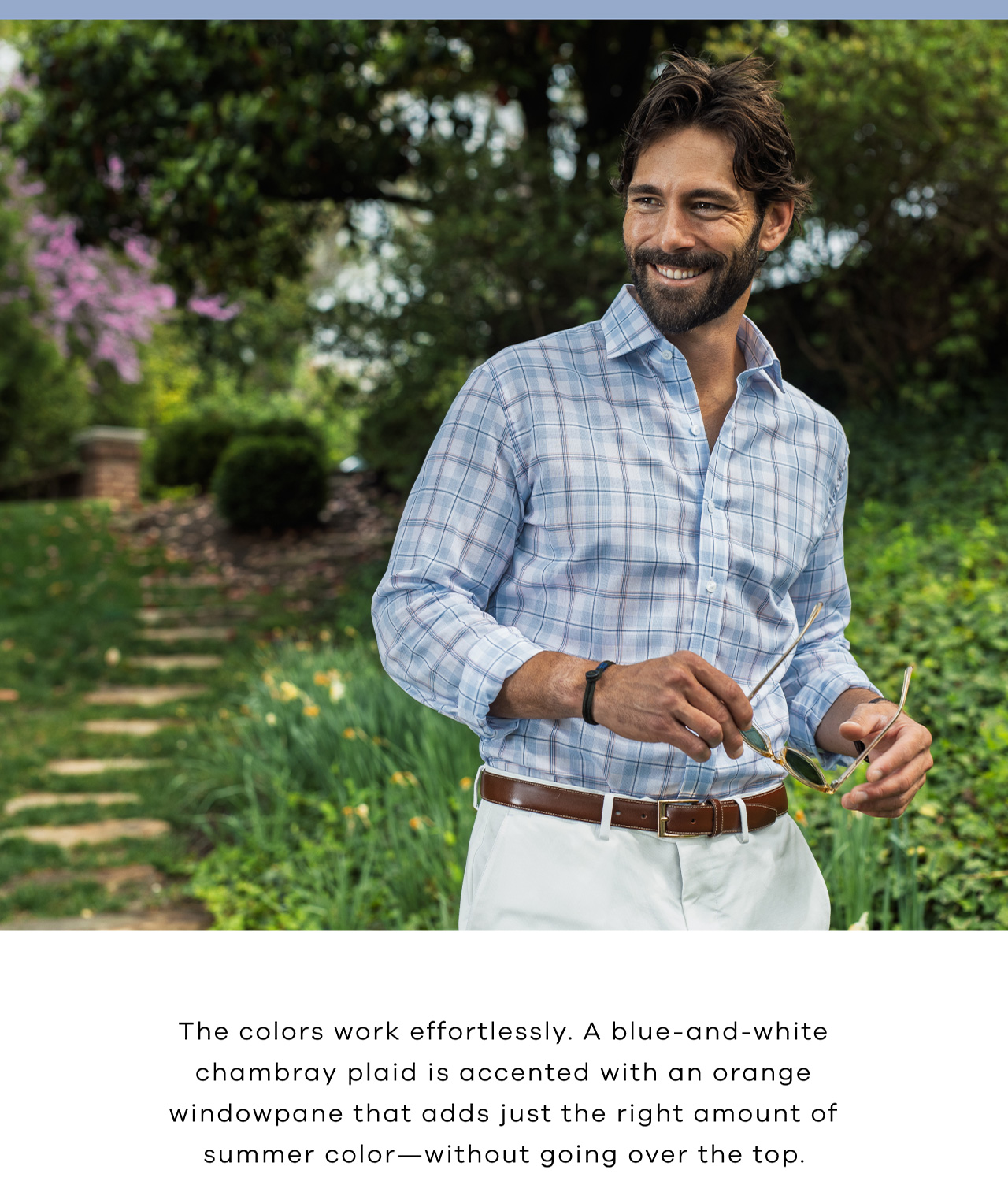 The colors work effortlessly. A blue-and-white chambray plaid is accented with an orange windowpane that adds just the right amount of summer color—without going over the top. 